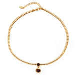 LIVKE’s gold tiger eye oval pendant on a snake chain, styled with a linen dress for boho-chic everyday elegance.