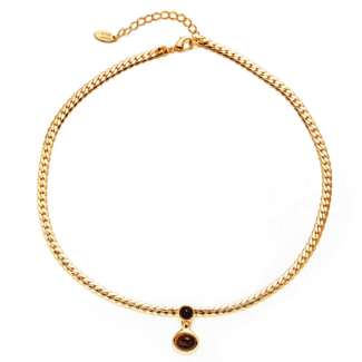 LIVKE’s gold tiger eye oval pendant on a snake chain, styled with a linen dress for boho-chic everyday elegance.