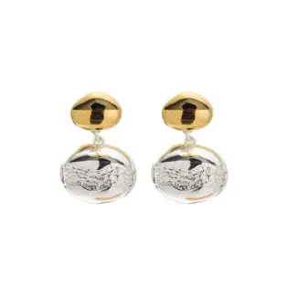 Close-up of brass gold-plated stud earrings showcasing elegant minimalist design.