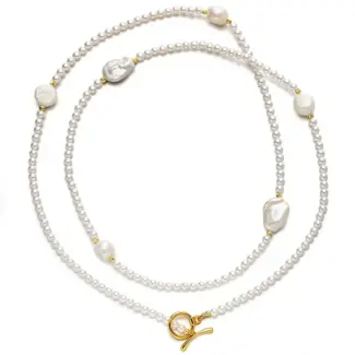 LIVKE’s irregular freshwater pearl necklace on a gold chain, styled with a beige sweater for minimalist everyday elegance.