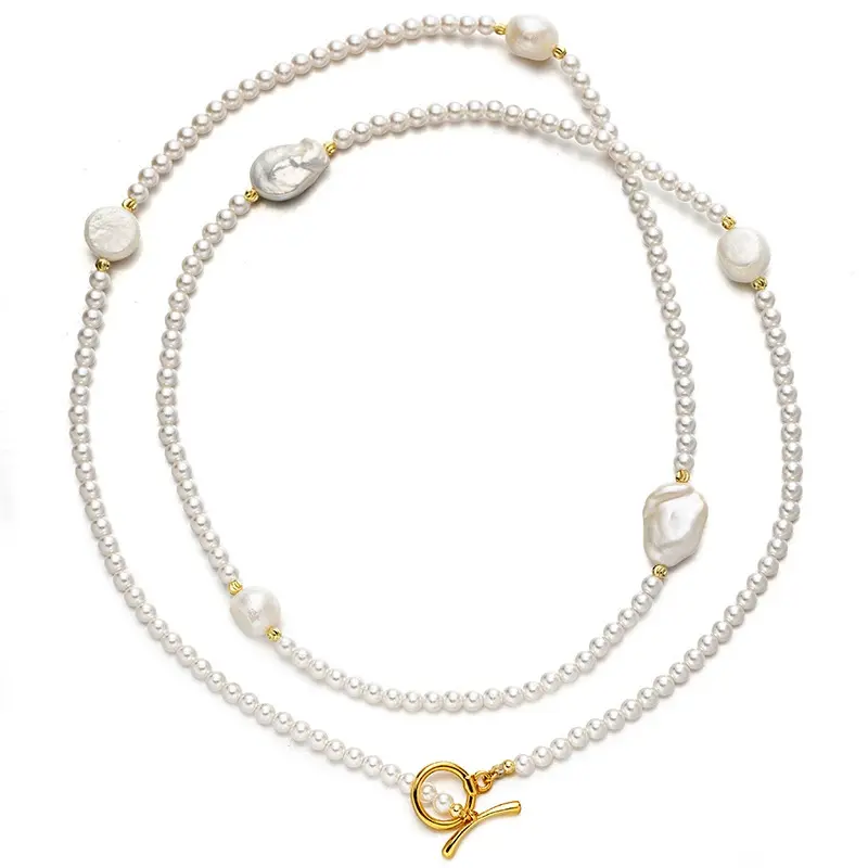 LIVKE’s irregular freshwater pearl necklace on a gold chain, styled with a beige sweater for minimalist everyday elegance.
