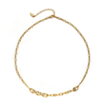 Three LIVKE gold layered necklaces with minimalist pendants, styled over a white tee for casual-chic everyday outfits.