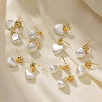 LIVKE’s vintage heart stud earrings with textured gold finish, styled with a denim jacket for casual-chic outfits.
