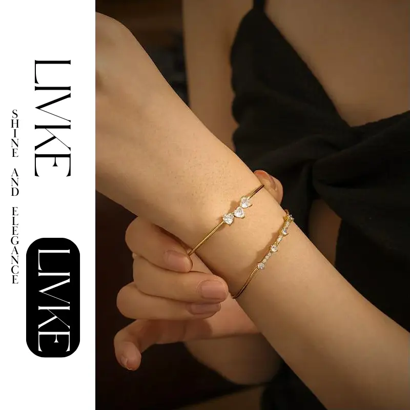 LIVKE’s gold open cuff bracelet with cubic zirconia, styled with a white shirt and watch for modern minimalist elegance.