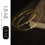 LIVKE’s gold open cuff bracelet with cubic zirconia, styled with a white shirt and watch for modern minimalist elegance.