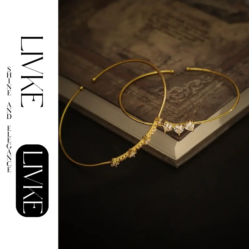 LIVKE’s gold open cuff bracelet with cubic zirconia, styled with a white shirt and watch for modern minimalist elegance.
