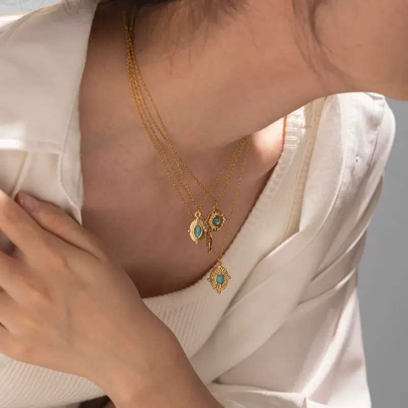 LIVKE’s gold oval bead necklace with intricate vintage texture, styled with a black evening gown for royal-inspired elegance.
