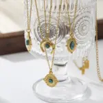 LIVKE’s gold oval bead necklace with intricate vintage texture, styled with a black evening gown for royal-inspired elegance.