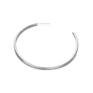 LIVKE’s minimalist sterling silver hoop earrings styled with a white button-up for office-ready elegance.