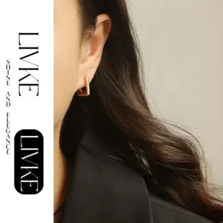LIVKE’s gold geometric square hoop earrings styled with a black turtleneck for minimalist urban elegance.