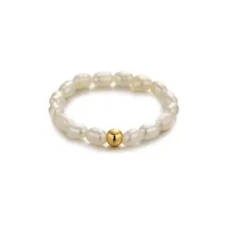 Vintage freshwater pearl set in 18K gold filigree band, styled with lace gloves for bridal elegance.