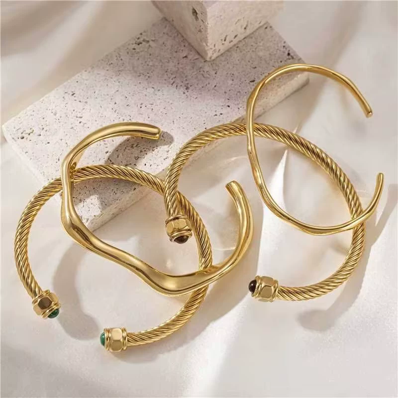 LIVKE’s minimalist gold adjustable bangle bracelet styled with a white button-up for office elegance.