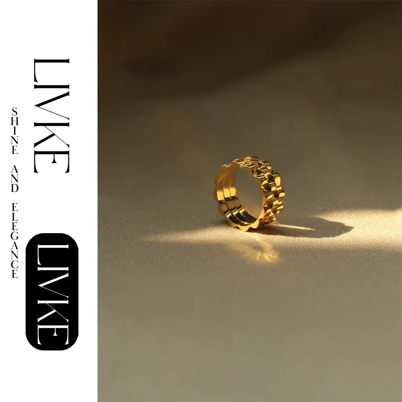 LIVKE’s gold gear ring on a hand with black polish, styled with a leather jacket for urban minimalist edge.