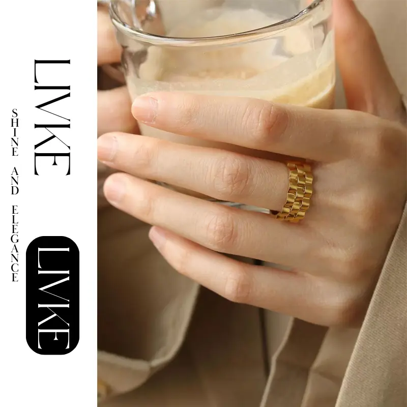 LIVKE’s gold gear ring on a hand with black polish, styled with a leather jacket for urban minimalist edge.