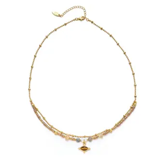 LIVKE’s tiger eye bead necklace with gold and zirconia accents, styled with a linen dress for boho everyday elegance.