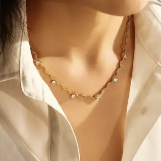 LIVKE 18K gold-plated asymmetric chain necklace with cubic zirconia stones, layered with minimalist bar pendant for day-to-night jewelry styling