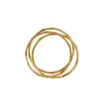 Three layered brass rings with spiral/chain/wave designs in 18K gold plating, stacked on a wooden tray for boho style