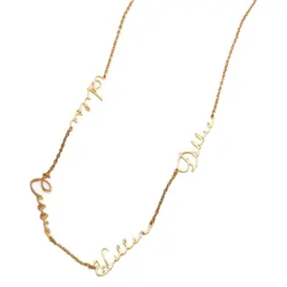 Gold name necklace with 'Believe' engraved in modern font on collarbone