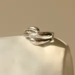 Architect wearing LIVKE geometric ring with concrete maquette in Berlin gallery, demonstrating jewelry as micro-architecture