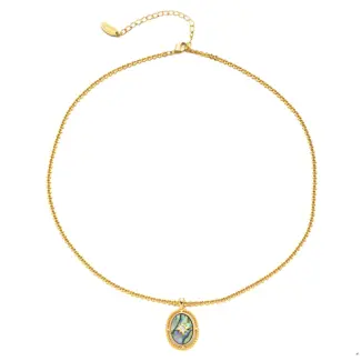 Layered oceanic necklaces on sand with seashells under sunset light