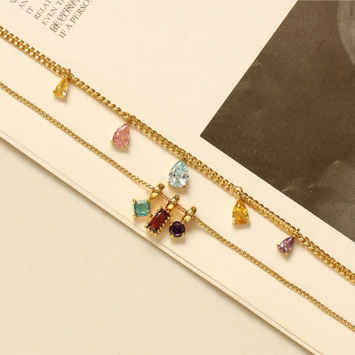 Woman wearing LIVKE multicolor zirconia necklace transitioning from office blazer to cocktail dress, showcasing prismatic jewelry for versatile styling