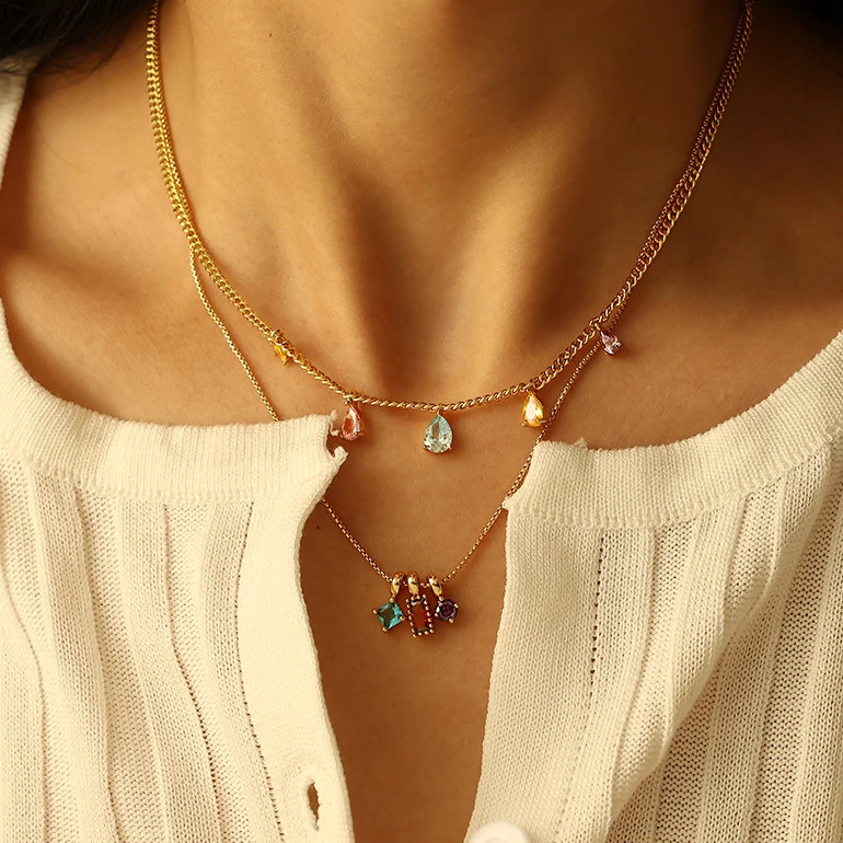 Woman wearing LIVKE multicolor zirconia necklace transitioning from office blazer to cocktail dress, showcasing prismatic jewelry for versatile styling