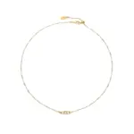 Delicate gold and silver chain set with iridescent shell pendants, perfect for beach weddings and minimalist jewelry lovers