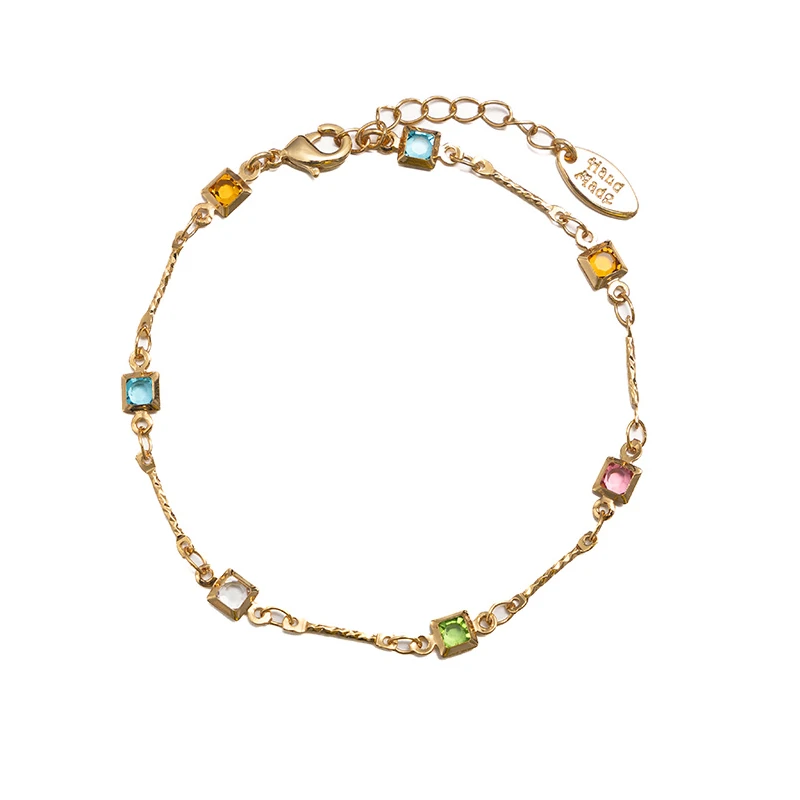 Delicate chain bracelet with six colorful square zirconia stones in Bauhaus-inspired geometric arrangement, perfect for minimalist jewelry lovers and modern gift ideas