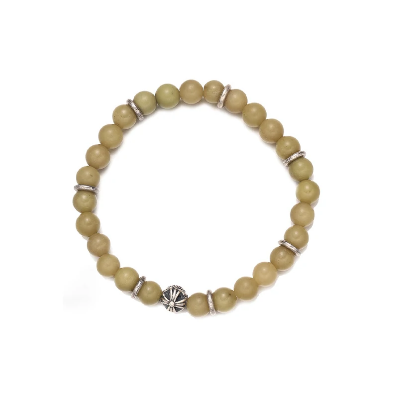 Olive green aventurine bead bracelet with silver feather charm and floral spacer beads, designed for spiritual healing and crystal energy jewelry lovers